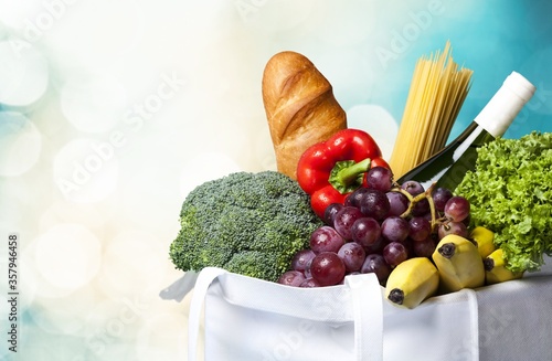 Full shopping bag with vegetable on bokeh background