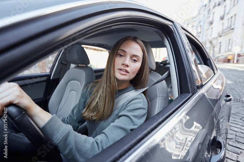 Lovely young female driver watching the road © Yakobchuk Olena