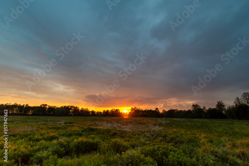colorful sunset over the Polish meadow, marshes
