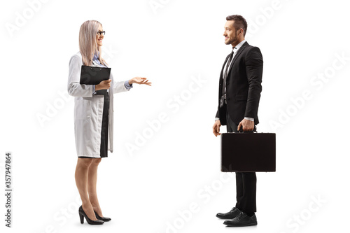 Female doctor having a conversation with a businessman photo