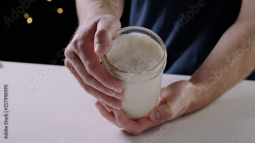 Wallpaper Mural Chef holding a mother dough starter in hands Torontodigital.ca