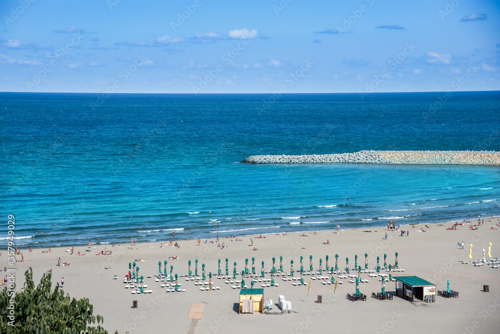 Aerial view of the beach in Constanta with blue black sea water in summer holiday in Romania