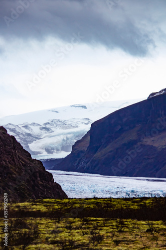 Ancient Glacier Rests in between the Mountains and the Meadows at Skaftafell National Park in the Golden Circle of Iceland