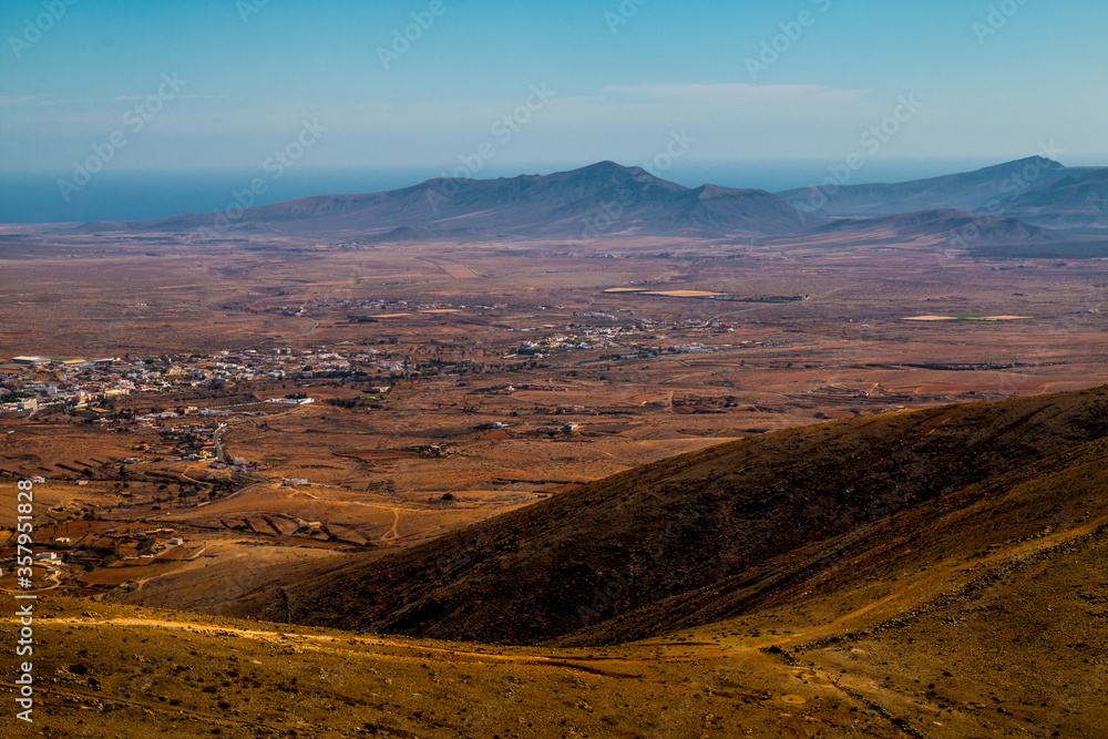 Landscape of Panoramic vulcanic mountains and Atlantic Ocean , dunes of coralejo and Gran Tarajal Port in Fuerteventura, Lanzarote Landscape of Panoramic vulcanic mountains and Atlantic Ocean , dunes of coralejo and Gran Tarajal Port in Fuerteventura, Lanzarote