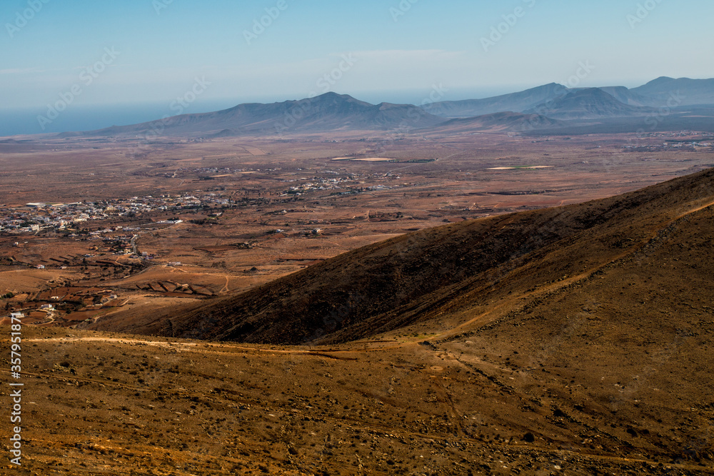 Landscape of Panoramic vulcanic mountains and Atlantic Ocean , dunes of coralejo and Gran Tarajal Port in Fuerteventura, Lanzarote Landscape of Panoramic vulcanic mountains and Atlantic Ocean , dunes of coralejo and Gran Tarajal Port in Fuerteventura, Lanzarote