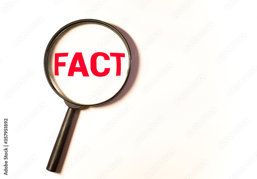 Hand Showing Facts Word Through Magnifying Glass Hand Showing Facts Word Through Magnifying Glass