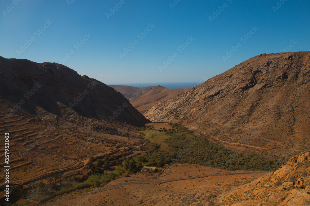 Landscape of Panoramic vulcanic mountains and Atlantic Ocean ,  dunes of coralejo and Gran Tarajal Port in Fuerteventura, Lanzarote 