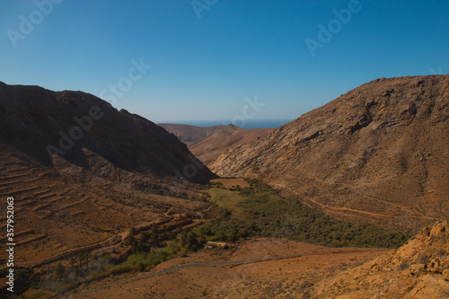 Landscape of Panoramic vulcanic mountains and Atlantic Ocean ,  dunes of coralejo and Gran Tarajal Port in Fuerteventura, Lanzarote  © Martina
