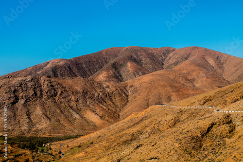 Landscape of Panoramic vulcanic mountains and Atlantic Ocean , dunes of coralejo and Gran Tarajal Port in Fuerteventura, Lanzarote 