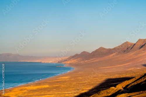 Landscape of Panoramic vulcanic mountains and Atlantic Ocean ,  dunes of coralejo and Gran Tarajal Port in Fuerteventura, Lanzarote  photo