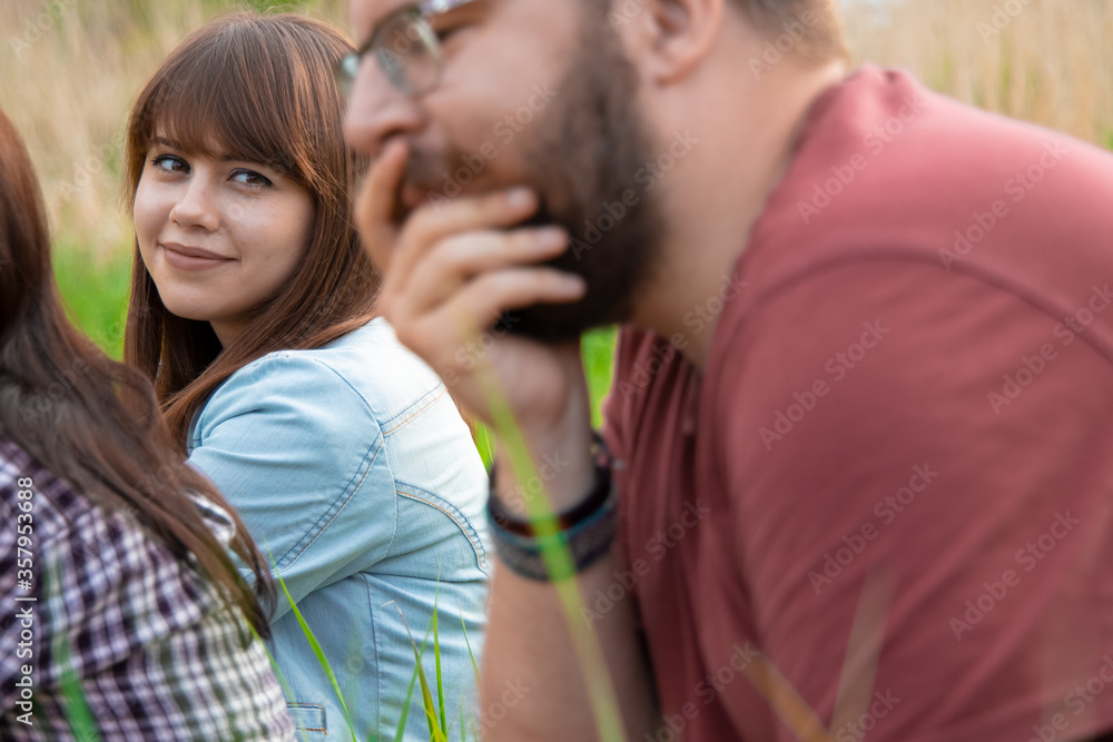 love stare group of people concept photography of attractive girl looking on man outdoor walking time in company in summer day