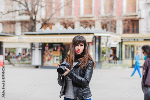 Female photographer taking photos in the city