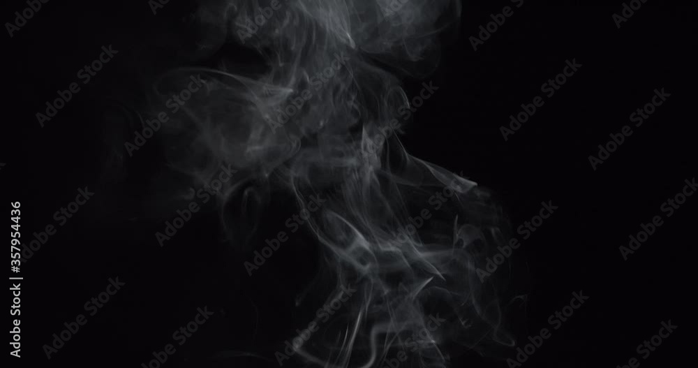 Smoke , vapor , fog clouds in motion isolated on black background. White steam ascends over pan Smoke , vapor , fog clouds in motion isolated on black background. White steam ascends over pan