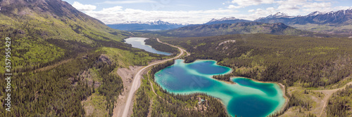 Stunning turquoise green lake in northern Canada, Yukon Territory. Emerald Lake located outside of Whitehorse in the Klondike. Wild and untouched. 