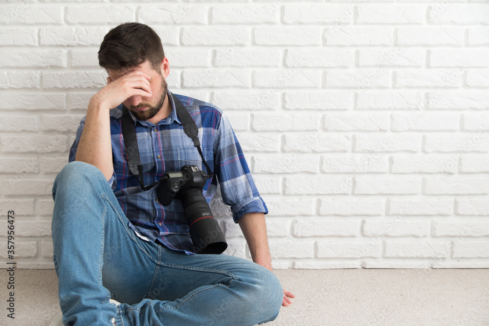 Adult photographer with camera searching for a job Adult photographer with camera searching for a job