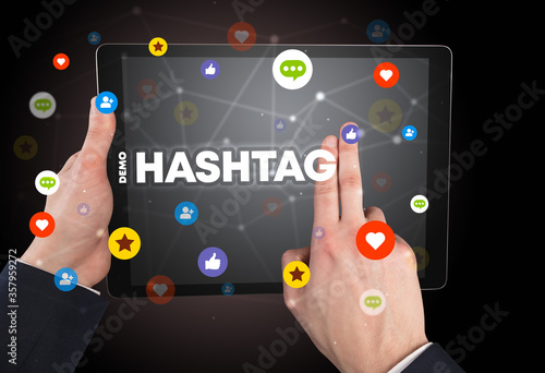 Close-up of a touchscreen with #HASHTAG inscription, social networking concept