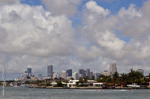 View of jet ski boats racing on Biscayne Bay and the downtown Miami tall building skyline.