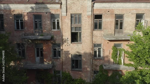 Wallpaper Mural Abandoned early 20th century apartment house (multi-story building) with broken windows and balconies. Aerial view Torontodigital.ca