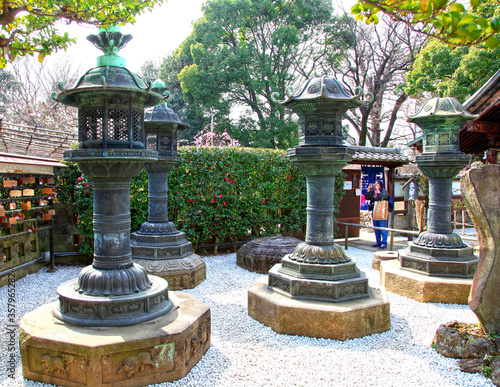 The Ueno Toshugu Shrine is located in Ueno Park in Tokyo, Japan and is brightly gold in colour. photo