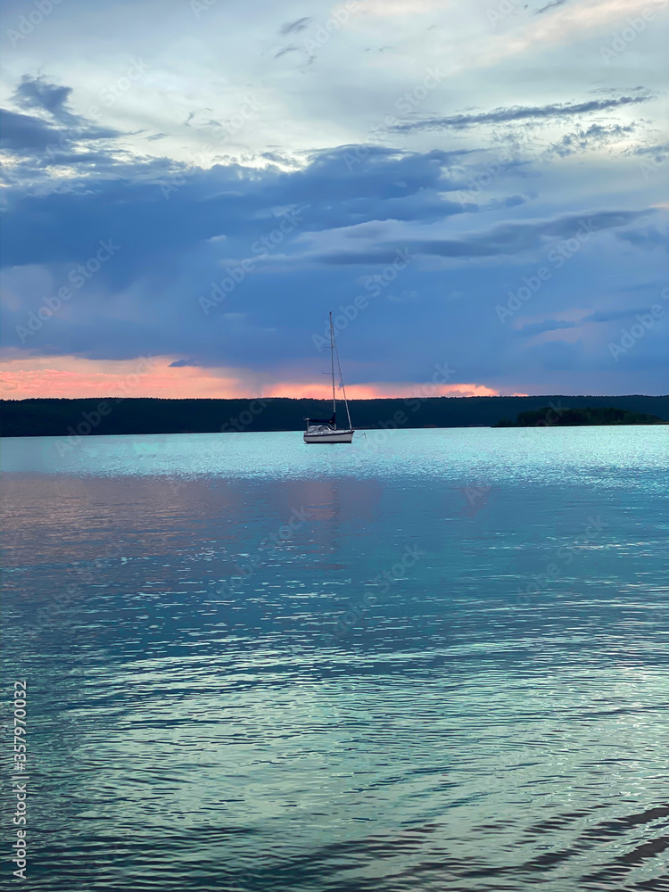Obraz premium photo of sunset on the river, in artistic processing, unrealistic
