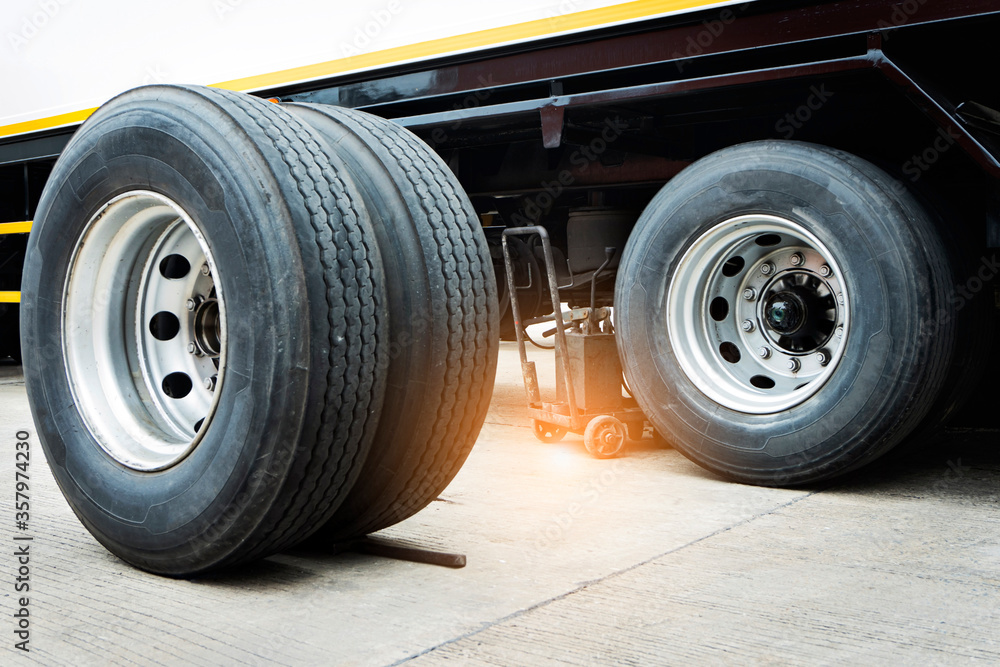 truck spare wheels ,tire waiting for to change, trailer wheels maintenance