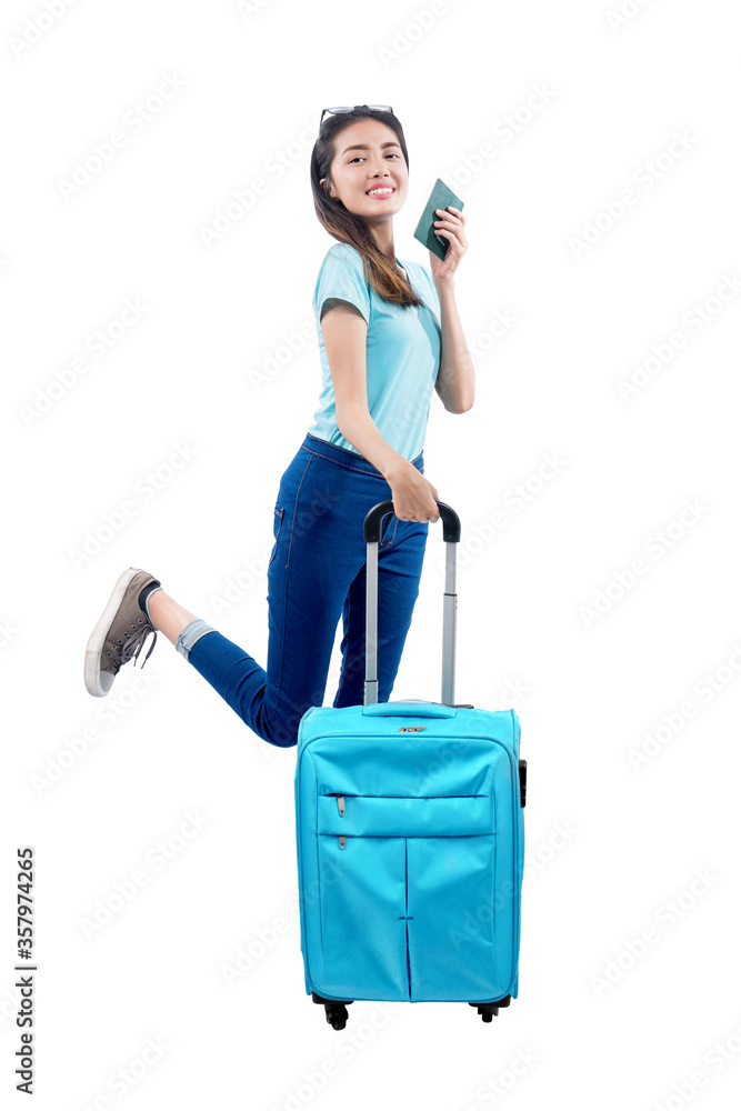Asian woman standing with a suitcase holding passport Asian woman standing with a suitcase holding passport