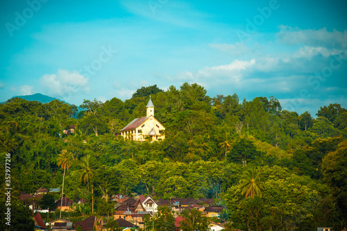 View to the green hill with church