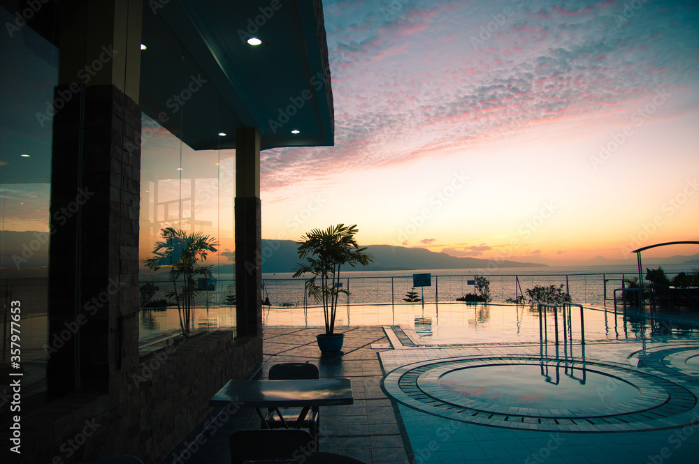 Fototapeta premium Sunset view to lake Toba from the pool