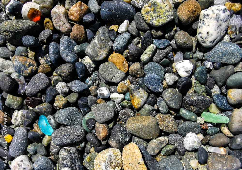 Sea Glass On Ocean Beach with Stones Rocks Sea Glass On Ocean Beach with Stones Rocks