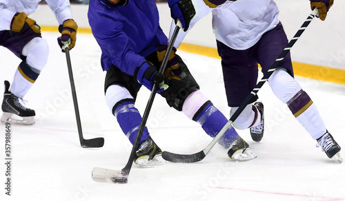 Photography Ice hockey player dribbling puck on rink
