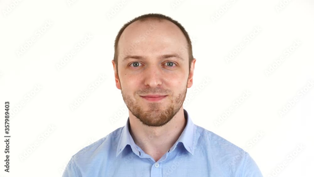 Handsome european man smiling at camera and showing call me gesture. Portrait of guy in shirt Handsome european man smiling at camera and showing call me gesture. Portrait of guy in shirt