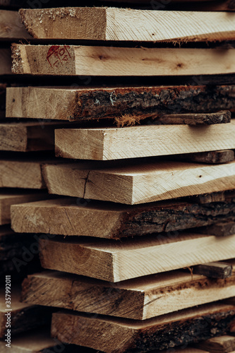 Piles of wooden boards in the sawmill, planking. 