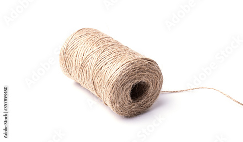 High-quality handmade coil made of natural hemp rope, isolated on a white background