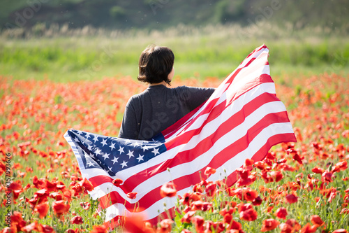 Patriot woman holding the american flag on the 4th of July