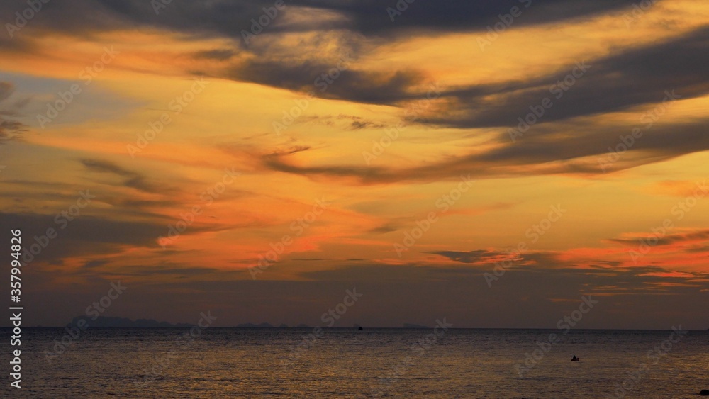 Sunset time above the ocean, water surface at sunset time, nature background static shot