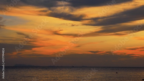 Sunset time above the ocean  water surface at sunset time  nature background static shot