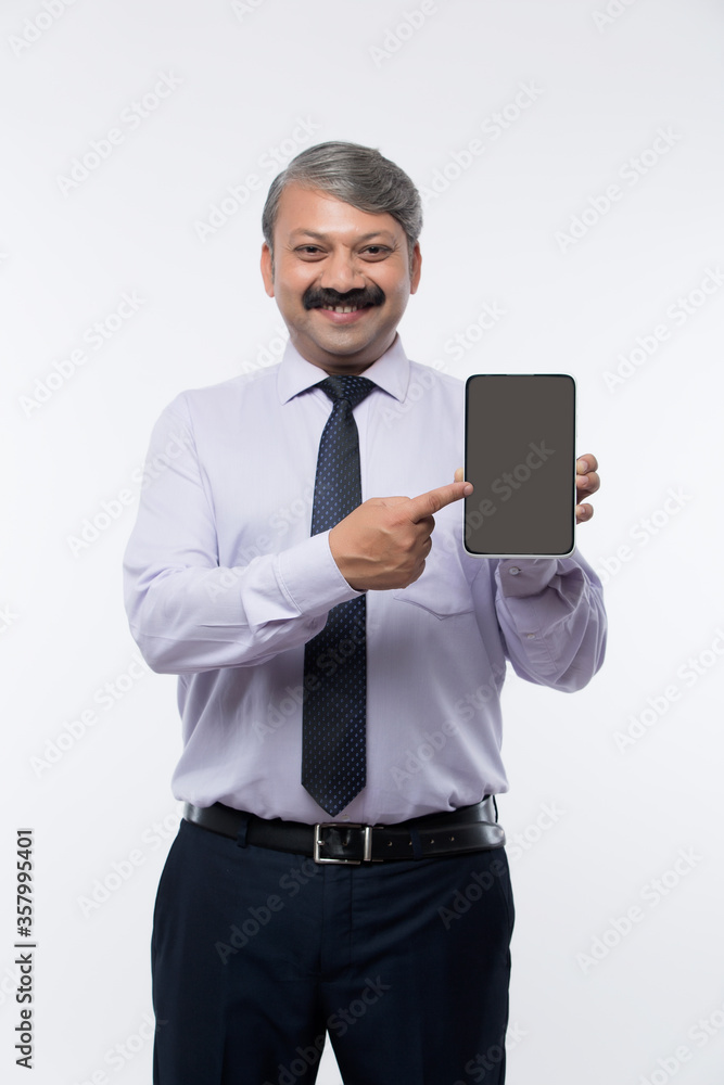 Businessman presenting a digital tablet with a blank display Businessman presenting a digital tablet with a blank display