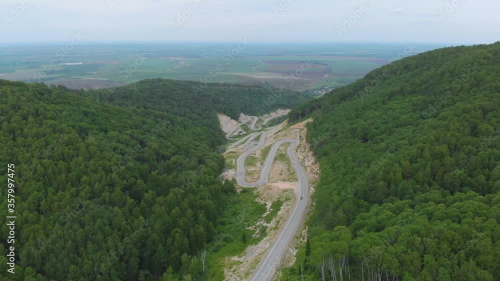 Aerial 4k drone video of top vew of winding road in the mountains, Altai Krai, Western Siberia, Russia. Road to Resort town Belokurikha 2 Aerial 4k drone video of top vew of winding road in the mountains, Altai Krai, Western Siberia, Russia. Road to Resort town Belokurikha 2