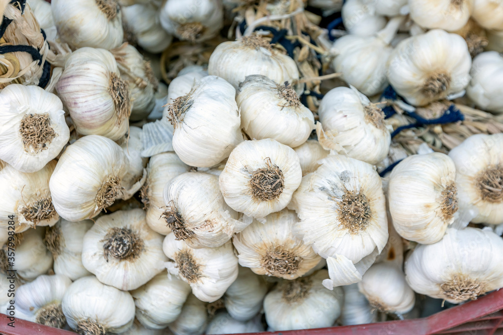 Background of the string of the dry garlics. Garlic is a fundamental component in many or most dishes of various regions, including eastern Asia, South Asia, Southeast Asia and the Middle East. Background of the string of the dry garlics. Garlic is a fundamental component in many or most dishes of various regions, including eastern Asia, South Asia, Southeast Asia and the Middle East.