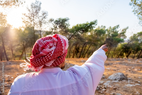 Arabic man enjoying being outdoor photo