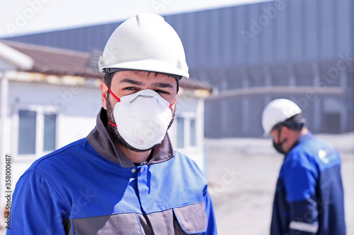 The worker is using personal protective equipments in the plant. Precautions must be taken to minimise the risk of virus transmission, especially in healthcare settings when performing procedures.