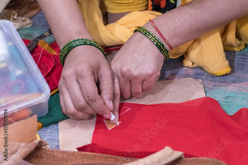 hands of Indian woman knittingcloth 