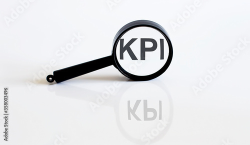 Magnifier with text KPI on the white background