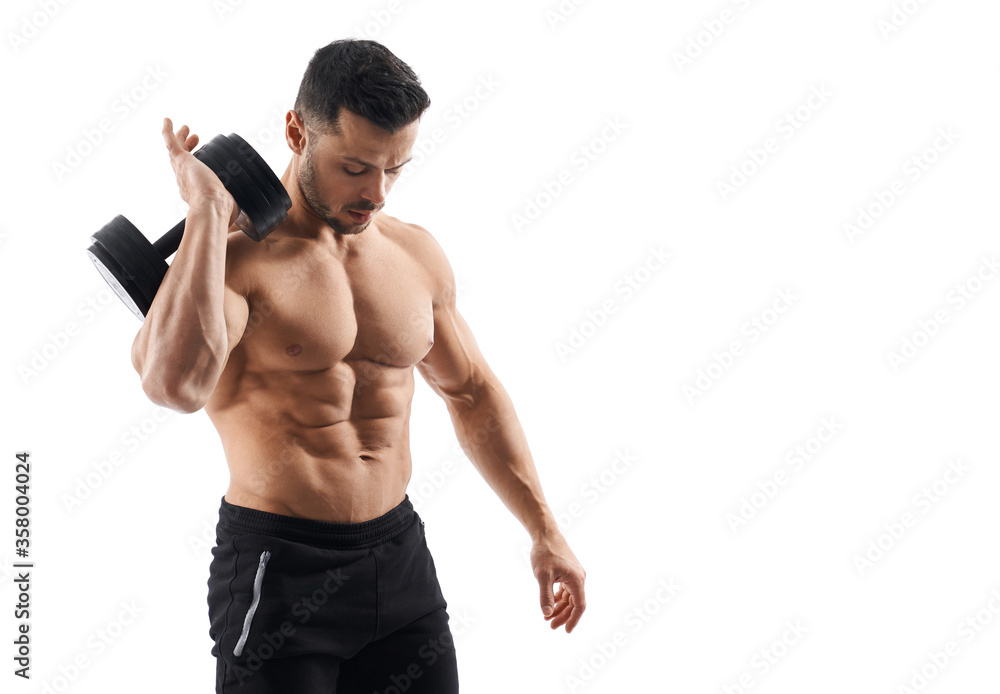 Fototapeta premium Shirtless bodybuilder holding dumbbell on shoulder.