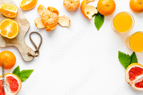 Frame with citrus fruits for juice top view