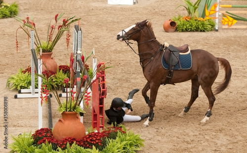 Konstfotografi Rider falling down from a  jumping horse that suddenly stooped