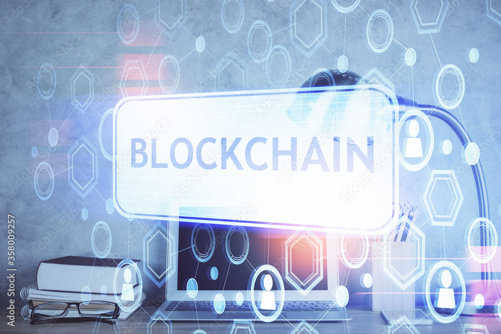 Double exposure of blockchain and crypto economy theme hologram and table with computer background. Concept of bitcoin cryptocurrency. Double exposure of blockchain and crypto economy theme hologram and table with computer background. Concept of bitcoin cryptocurrency.