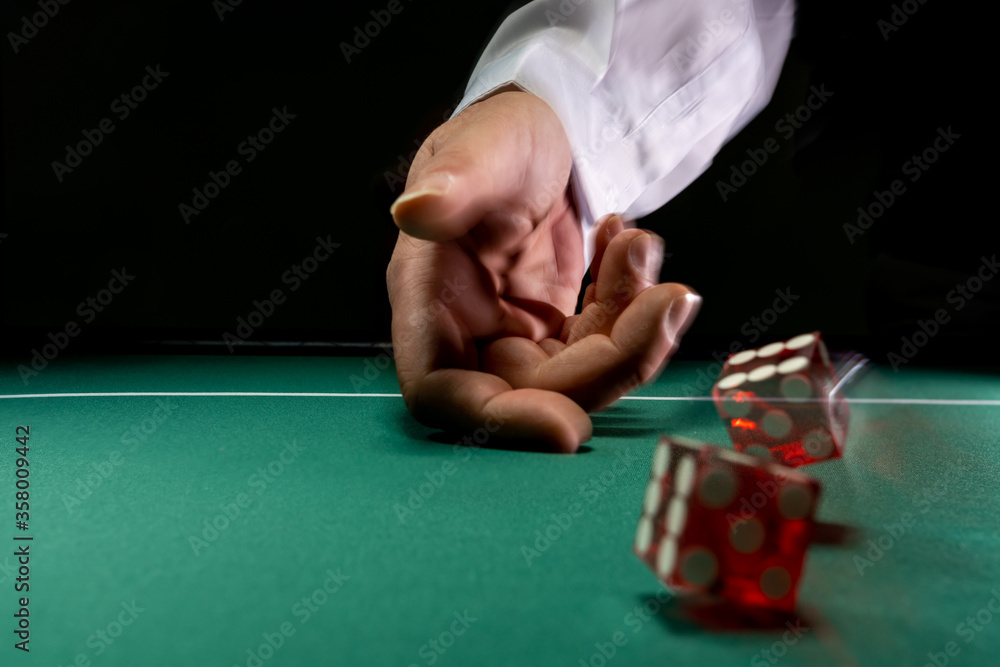 Man gambling at the craps table Man gambling at the craps table