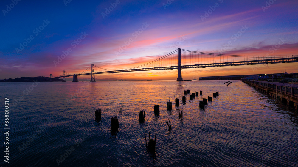 San Francisco-Oakland Bay Bridge at Sunrise with Colorful Clouds