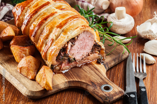 Pork tenderloin in wellington style in puff pastry photo